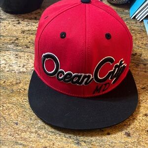 KBETHOS Red Cap with Black Accents Ocean City MD logo